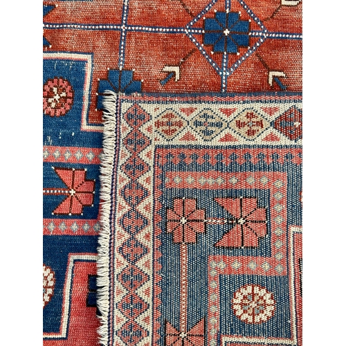 37 - Decorative Hand Made Rug. 159cm x 103cm.