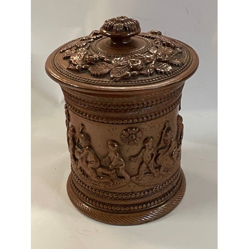 69 - Antique Salt glaze Cherub Decoration  Tobacco Jar. 11 cms Diameter X 12 Cms High.