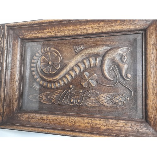 101 - Framed and Glazed Wood Carving depicting a Mythical sea creature, carved inscriptin verso. 49cm x 29... 