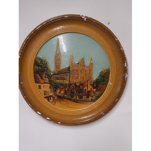 295 - Plaster wall plaque depicting Salisbury Cathedral, 39cm diameter