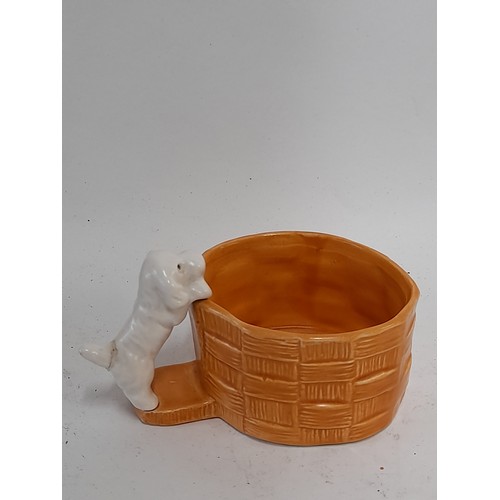 321 - Sylvac Ware, Puppy climbing into a Basket, 13cm wide