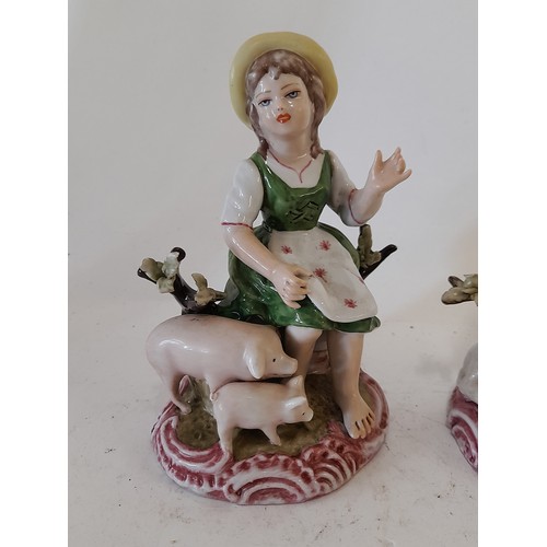 347 - 2 x Meissen marked figures, Boy with Lamb and Girl with Pigs, 13cm high