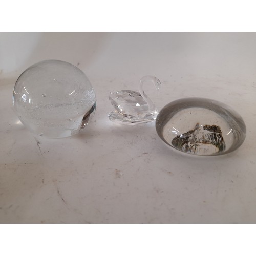 515 - Two  Glass Paper weights one depicting Pitteville Spa Cheltenham and a Swarowski Swan, 4cm high.    ... 