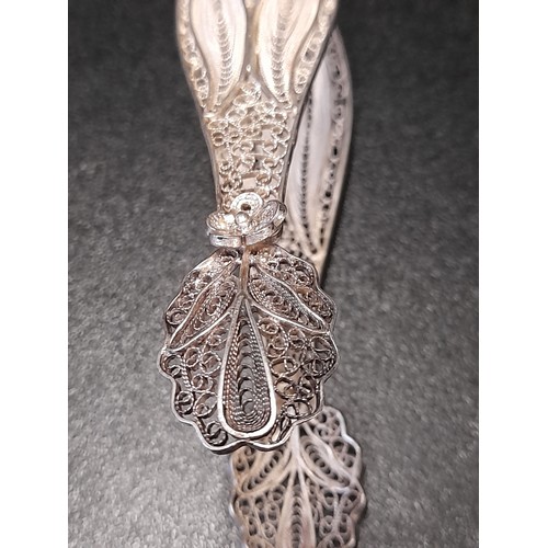 560 - Silver coloured Sugar Tongs with Filigree wire work, 14cm long