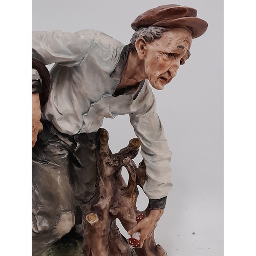 562 - Large Capodimonte Figure of an Old Man Picking Mushrooms,  30cm high x 26cm wide