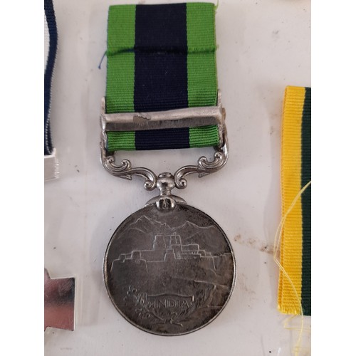 176 - 7 x Replica Military Medals and a Ribbon