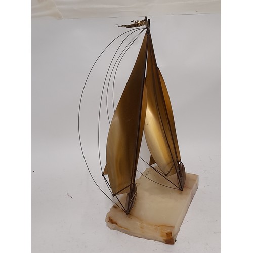 254 - Brass Sailing Boats mounted on an Onyx Base By John Demott , 38cm x 28cm x 20cm