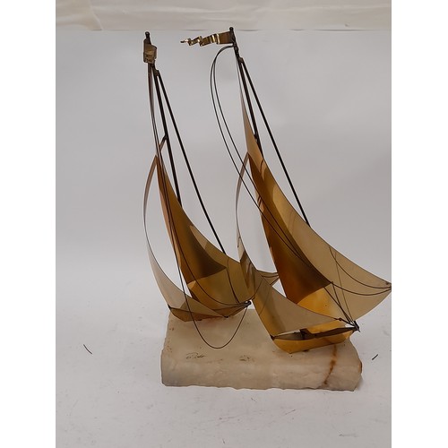 254 - Brass Sailing Boats mounted on an Onyx Base By John Demott , 38cm x 28cm x 20cm