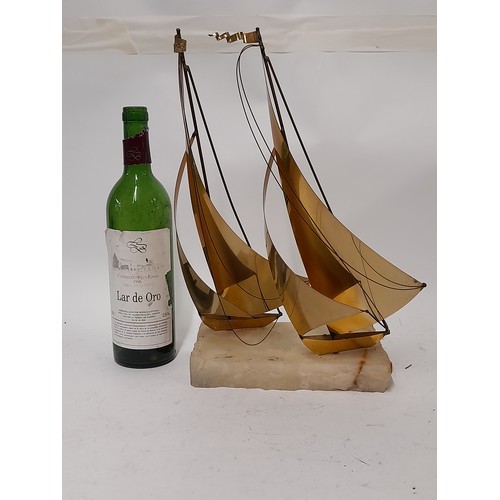 254 - Brass Sailing Boats mounted on an Onyx Base By John Demott , 38cm x 28cm x 20cm