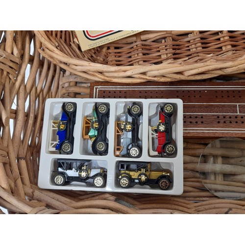 276 - 2 x Baskets largest 53cm x 42cm x 13cm a Quantity of Boxed Toy Cars, Magnifying Glass and a Crib Boa... 