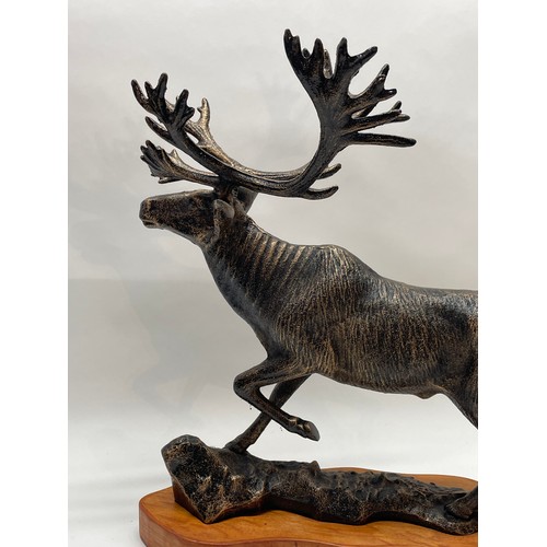 181 - Large Bronzed  Cast Iron Figure Of A Stag Mounted On Wood Plinth. 43 cms High x 38 cms