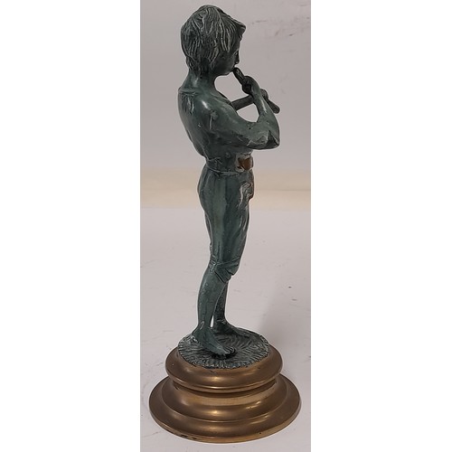 184 - Brass Figure with a Patinated Finish of a boy playing a Wind instrument, 25cm tall