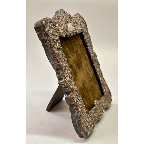 211 - Sterling Silver Decorative Wooden Backed Stand Picture Frame. 21cm x 15cm.