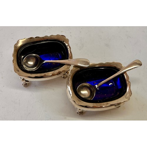 220 - Pair Of Four Footed Silver Hallmarked Blue Glass Salt Cellars To Include Two Silver Hallmarked Spoon... 
