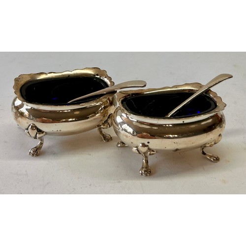 220 - Pair Of Four Footed Silver Hallmarked Blue Glass Salt Cellars To Include Two Silver Hallmarked Spoon... 