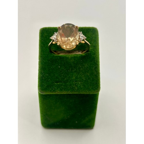 91 - 9Ct Gold Hallmarked Oregon Sunstone And White Zircon Ring. Uk Size Q, 2.55Grams. To include Authenti... 