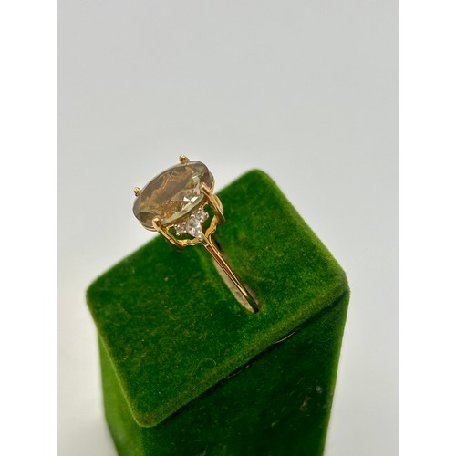 91 - 9Ct Gold Hallmarked Oregon Sunstone And White Zircon Ring. Uk Size Q, 2.55Grams. To include Authenti... 