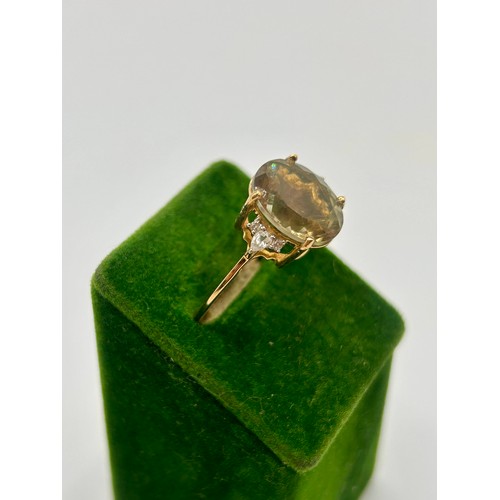 91 - 9Ct Gold Hallmarked Oregon Sunstone And White Zircon Ring. Uk Size Q, 2.55Grams. To include Authenti... 