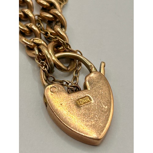 97 - 9CT Gold Hallmarked Curb Chain Heart Padlock Bracelet. 18.57Grams.