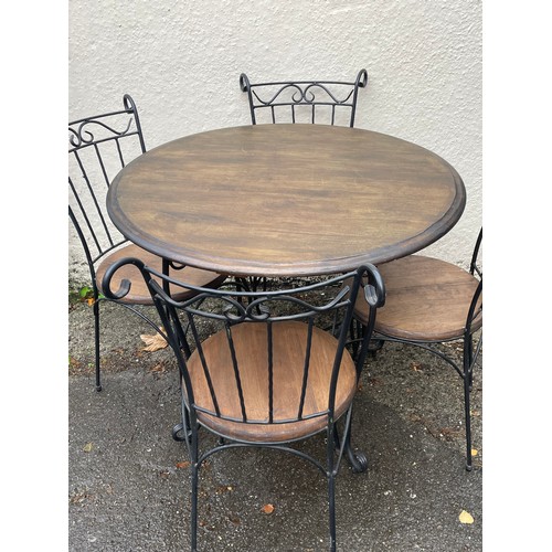 32 - Circular Ironwork And Wood Cafe Table And Four Chairs. Table 90 cms Diameter