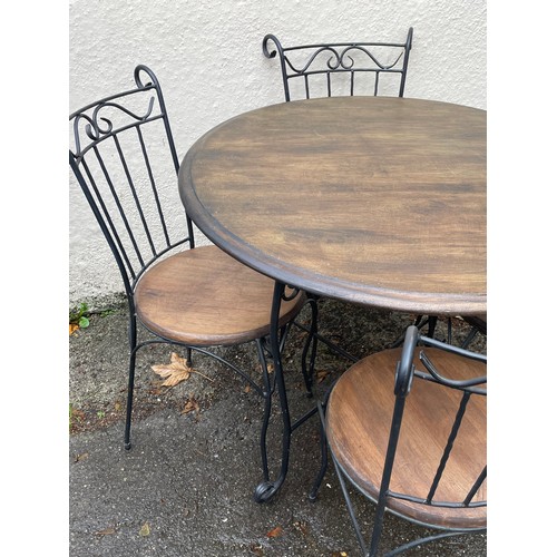 32 - Circular Ironwork And Wood Cafe Table And Four Chairs. Table 90 cms Diameter