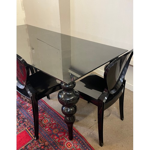 44 - Black Glass Top Table  And Four Plastic Chairs.