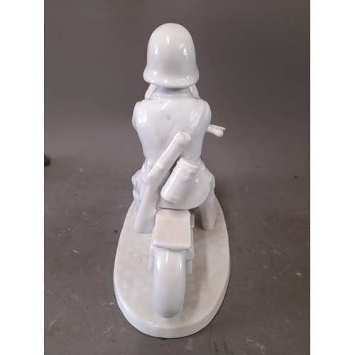 162 - White Porcelain German Motor cycle despatch rider with Cobalt Blue Mark KPM under stylised Third Rei... 