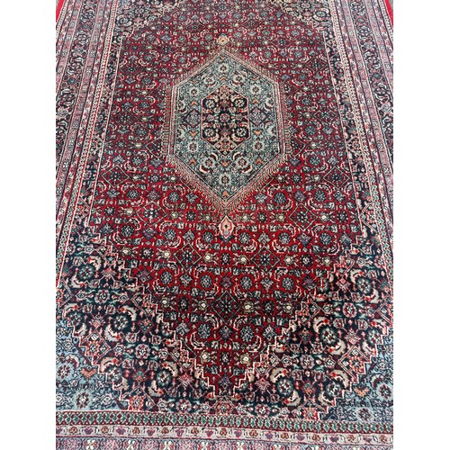 75 - Large Hand Made Decorative Bidjar Persian Rug. 312cm x 185cm.