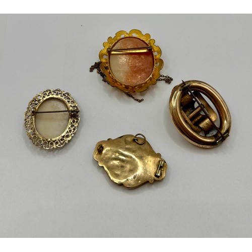 111 - Two Gold Coloured Cameo Brooches Along With Two Decorative Gem Set Brooches, Largest 5cm x 4cm.  (4)