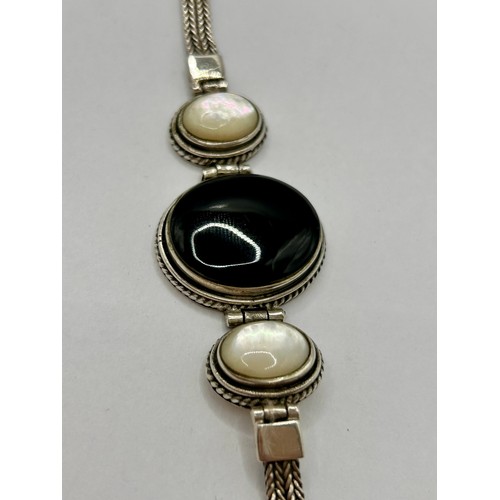 118 - Sterling Silver Onyx And Pearl Stone Rope Style Bracelet. 20cm Link To Link, 28.48Grams.