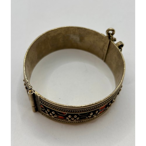 121 - Vintage Moroccan  Enamel Berberian Hinged Silver Bracelet. 8cm x 3cm, 57.56Grams.