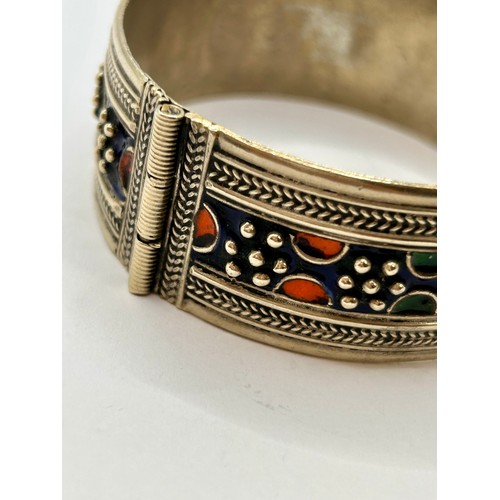 121 - Vintage Moroccan  Enamel Berberian Hinged Silver Bracelet. 8cm x 3cm, 57.56Grams.