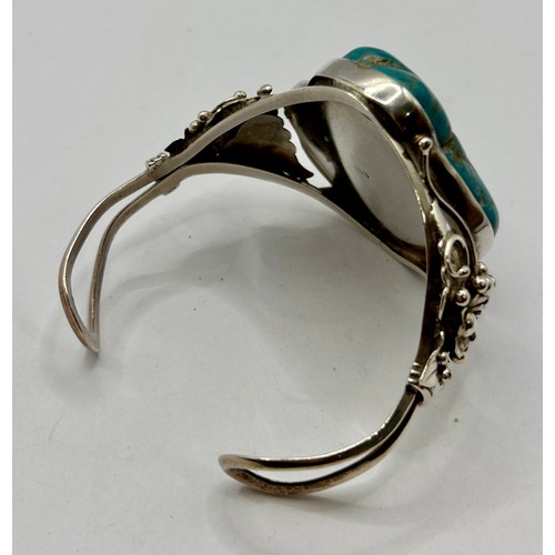 133 - Sterling Silver Stamped 925 Decorative Navajo Cuff Bracelet Featuring A Large Turquoise Stone. 10cm ... 