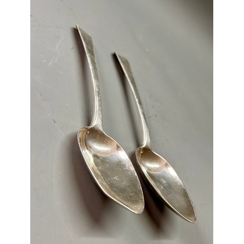 141 - Pair Of Georgian Silver Hallmarked Serving Spoons featuring Crest Of Canes. 22cm, Total 184.2Grams. ... 