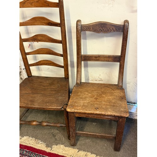 23 - Two Antique Chairs To Include A Antique Ladderback Low Chai. (2)