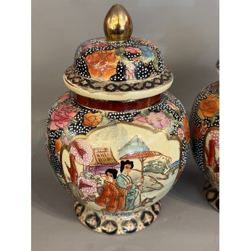 295 - Pair Of Hand Painted Satsuma Lidded Jars. 21 cms High (2)