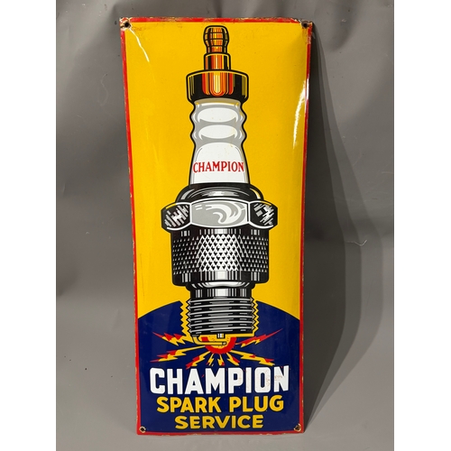 Enamel Advertising Sign Of Champion Spark Plugs. 71cm x 30cm.