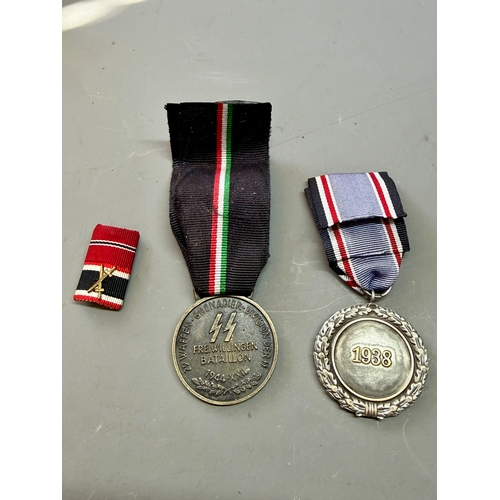 Two German Style WWII Medals Along With A Pin Badge. (3)