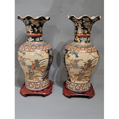 Matching Pair of Chinese made Japanese Satsuma Style Vases on Wooden ...