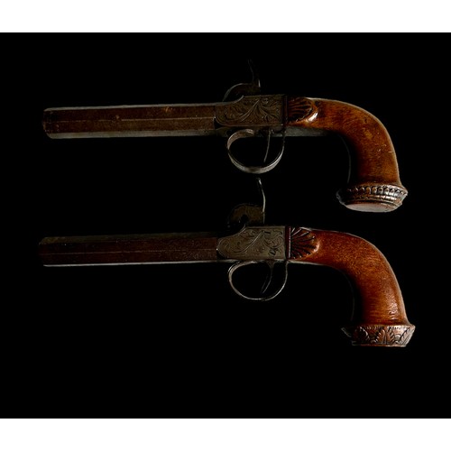 228 - A Pair Of Percussion Pistols With Walnut Stocks Chased Decoration To Steel
Size 21.3cm x 6.7cm