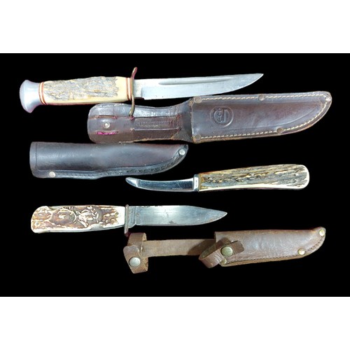 251 - 3 Solingen Knives. 1 Rostfrei Germany Horn Handled Knife with Scabbard, 1 DBGM Multi Knife with Scab... 