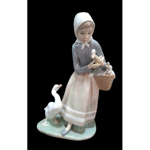 20 - Lladro 'Shepherdess with Ducks' 4568 Approx.225mm H, 3x Lladro Geese and a Nao Figure of 3 Ducks