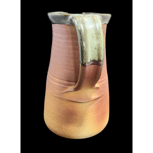 328 - John Leach (1939 - 2021) Stoneware Jug Impressed Muchelney. 24cm Tall