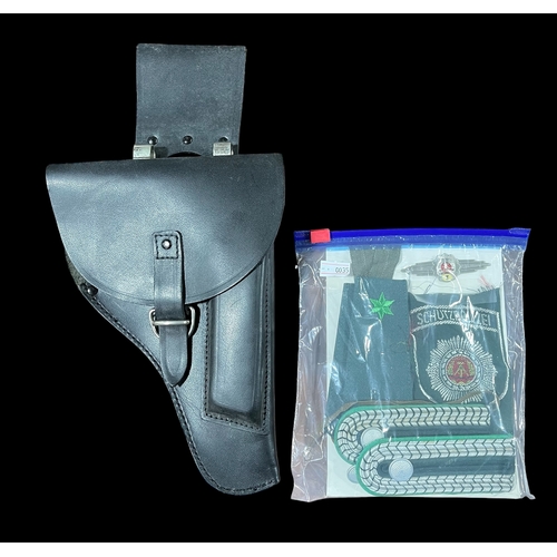 402 - Post - War East German Uniform Cap Pistol Holster and Badges.