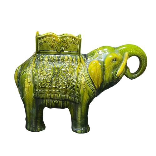 239 - A Green Glazed Elephant Plant Stand Possibly Burmantofts 38cm Long 27cm Tall.