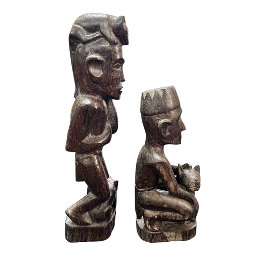 305 - A Pair of Sarawak Hard Wood Carvings Depicting Men With Dogs Tallest 50cm