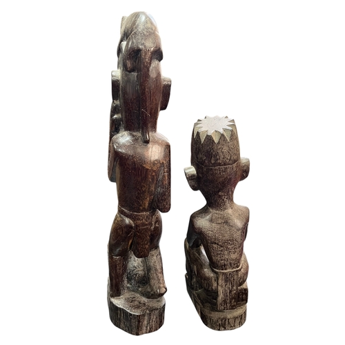 305 - A Pair of Sarawak Hard Wood Carvings Depicting Men With Dogs Tallest 50cm