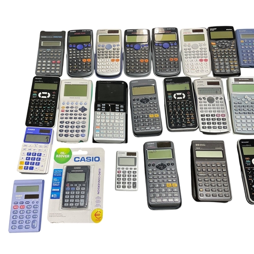 102 - A Collection of 30+ Mostly Scientific Calculators .Casio, Sharp, Canon etc.