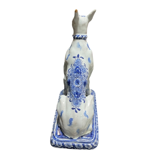208 - A Pair of Delft Blue & White Dogs with Floral Decoration Marked for Jacobus Adriansz Halder