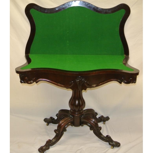 86 - Georgian rosewood card table with serpentine bordered fold-over top, on reeded baluster shaped colum... 